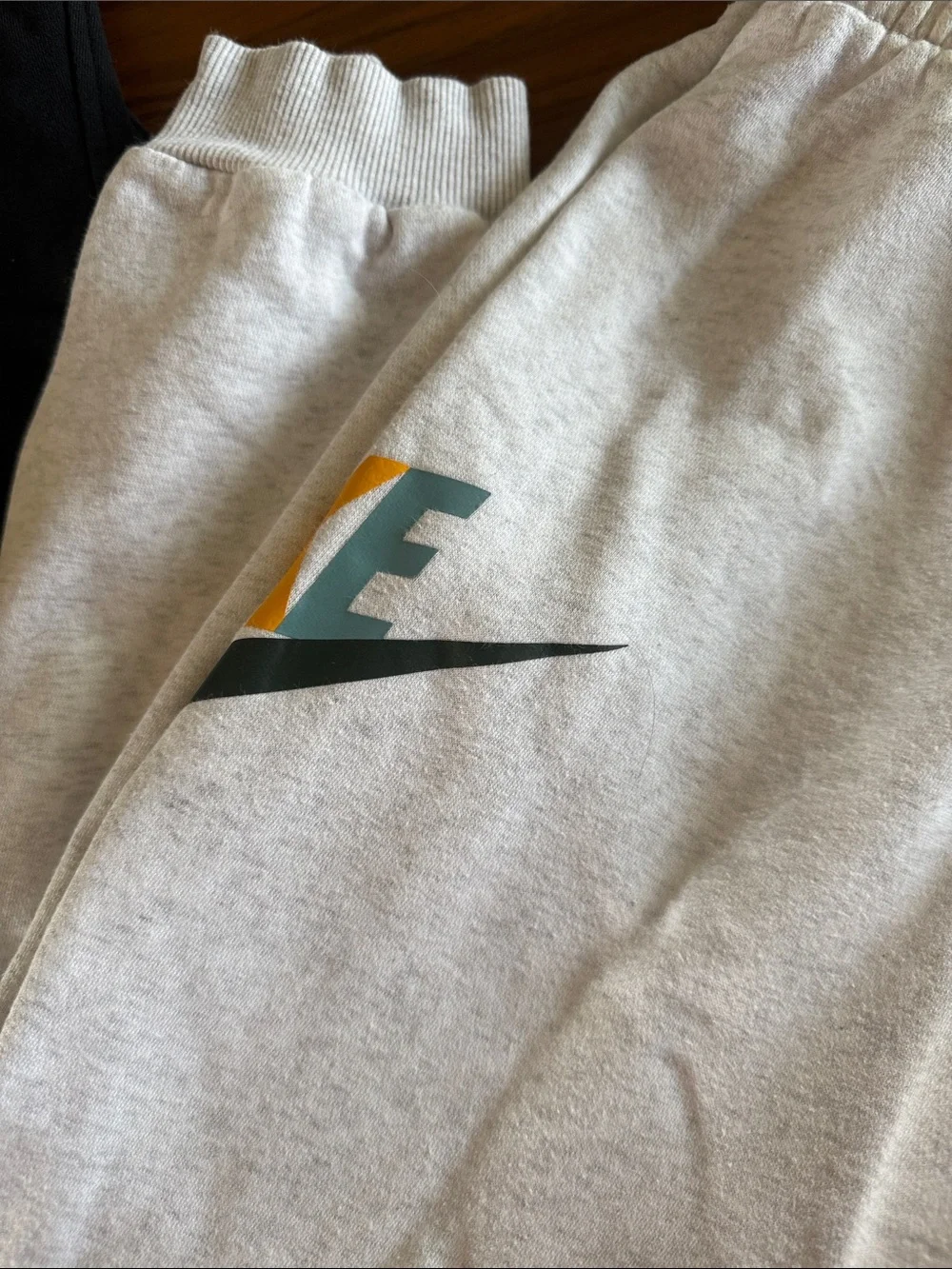 Nike Kids Two-Tone Sweatpants – Black & Light Gray with Multicolor Logo